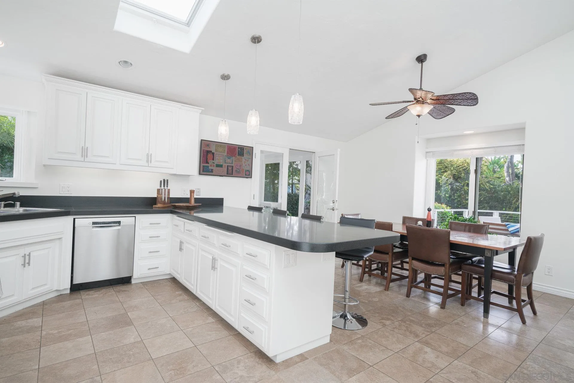 684 Arden Drive Encinitas, CA 92024 - Photo 50 of 59 a kitchen with stainless steel appliances kitchen island granite countertop a sink and cabinets