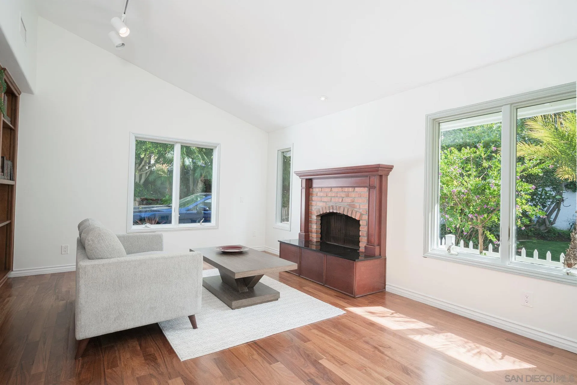 684 Arden Drive Encinitas, CA 92024 - Photo 53 of 59 a living room with furniture and a fireplace