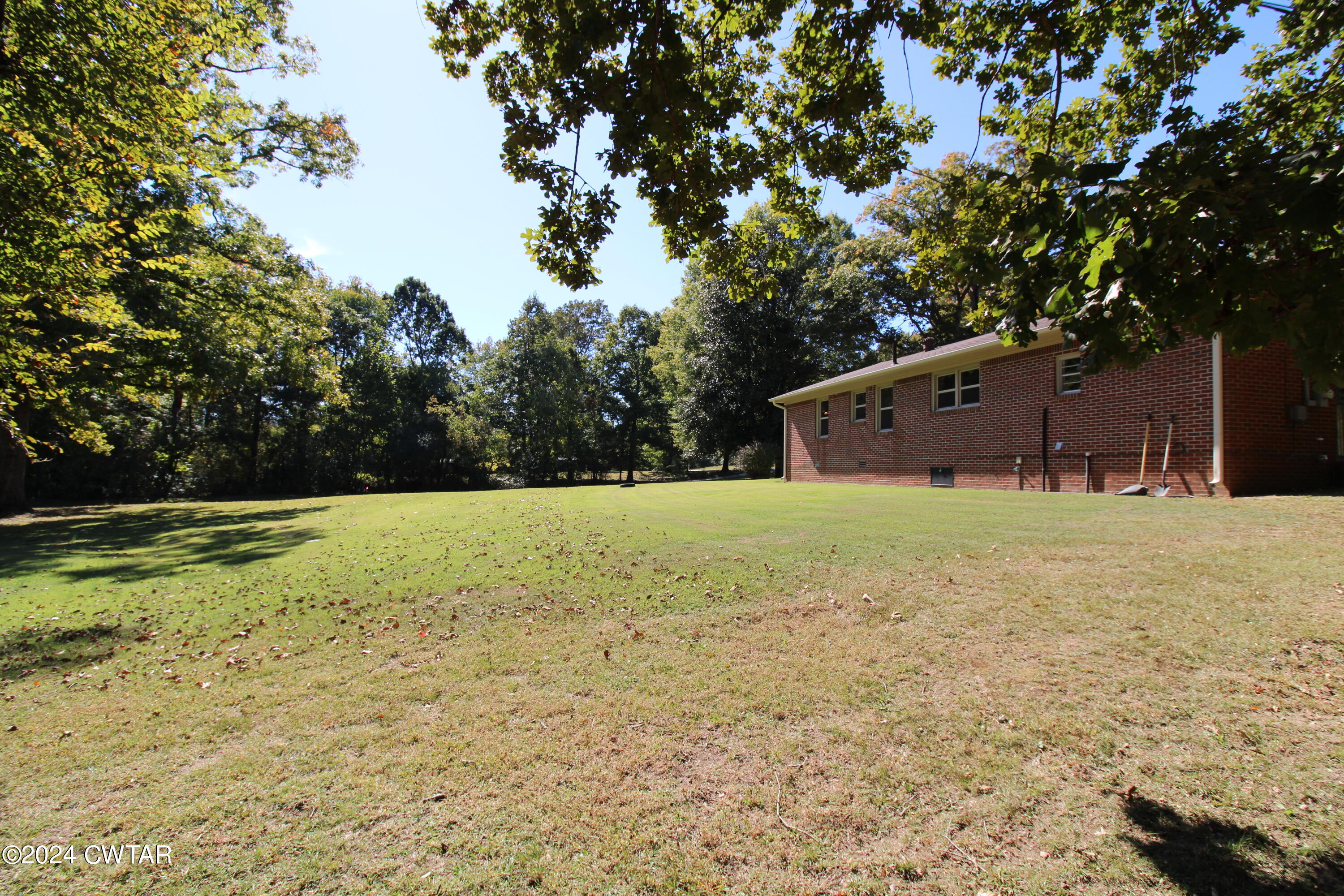 465 Crucifer Road Huron, TN 38345 - Photo 15 of 15 a view of a yard with a barn