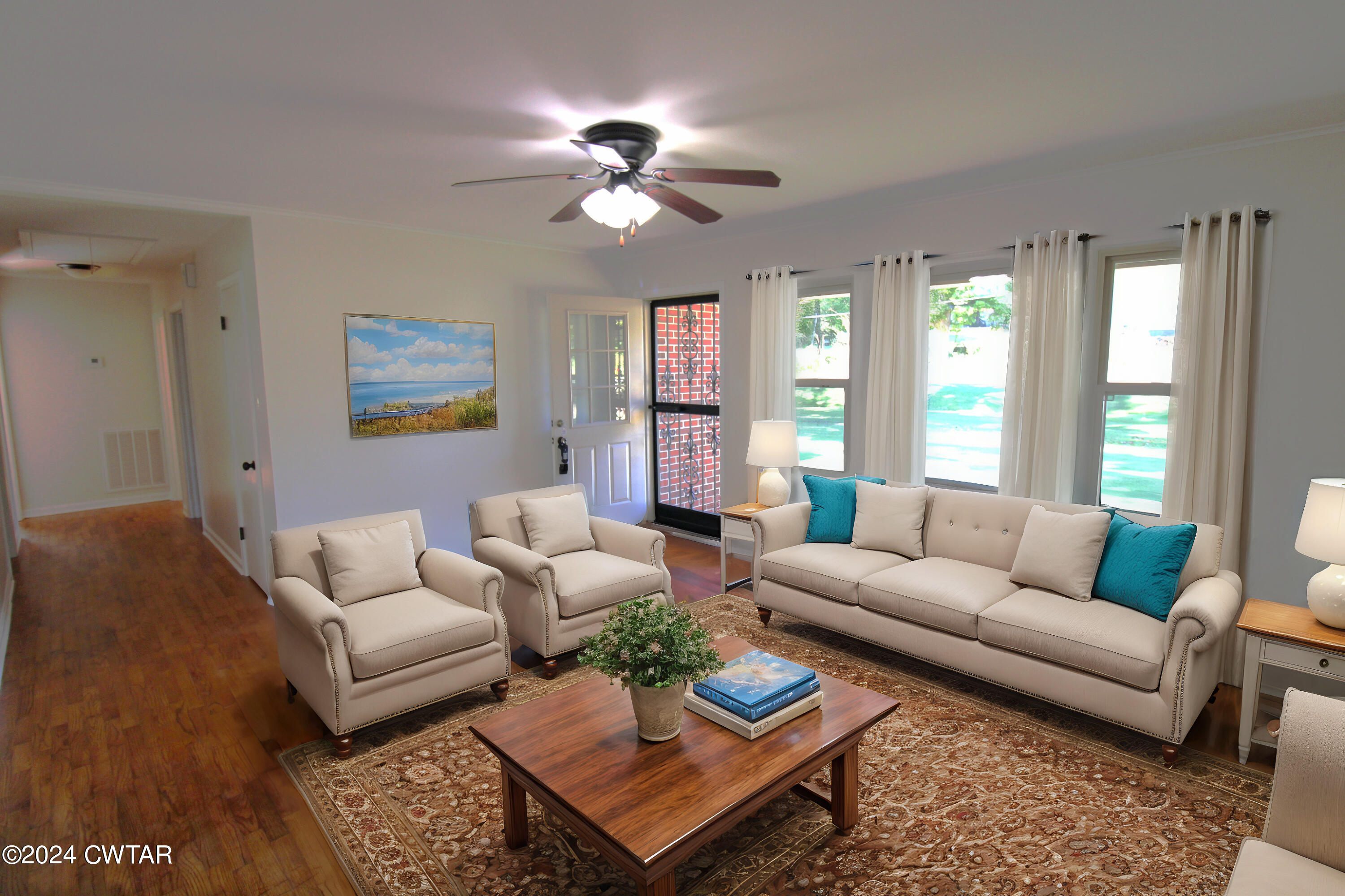465 Crucifer Road Huron, TN 38345 - Photo 2 of 15 a living room with furniture a chandelier and a window