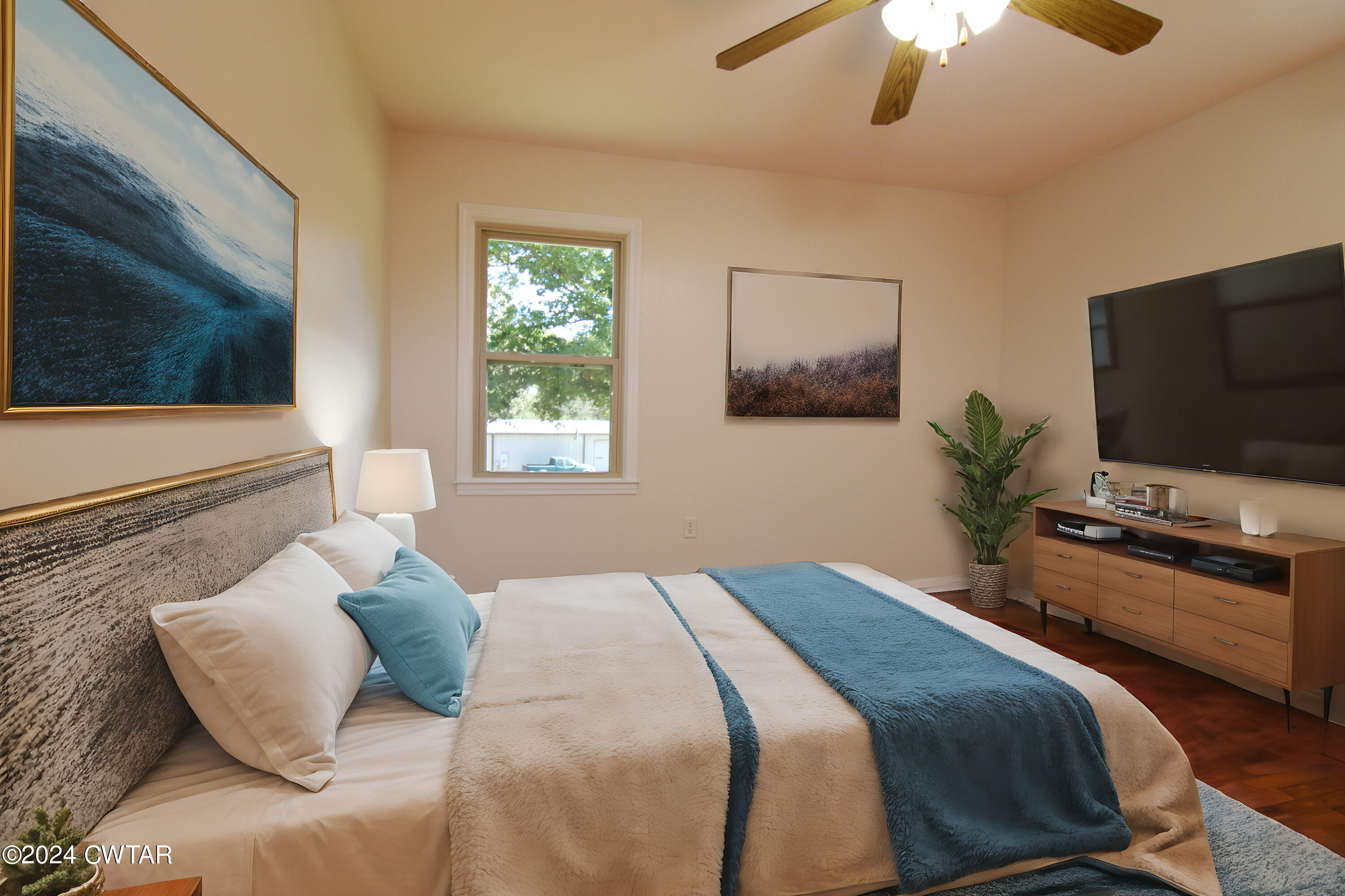 465 Crucifer Road Huron, TN 38345 - Photo 4 of 15 a bedroom with a bed and a flat screen tv