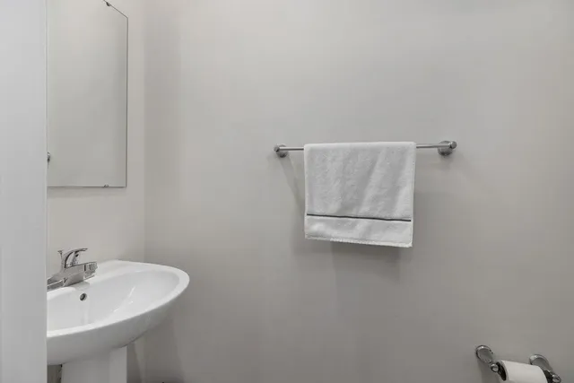 a bathroom with a sink and mirror