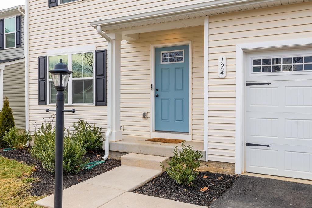 124 Walsh Lane Waynesboro, VA 22980 - Photo 2 of 42 a view of a pathway of the house with potted plants