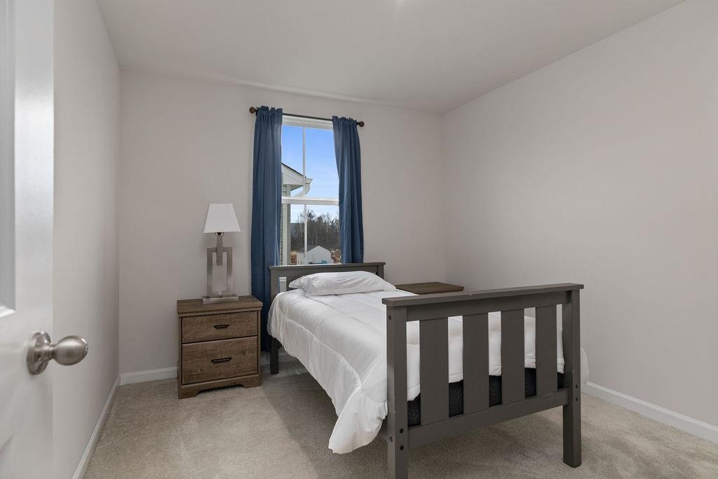 124 Walsh Lane Waynesboro, VA 22980 - Photo 22 of 42 a bedroom with a bed and a window