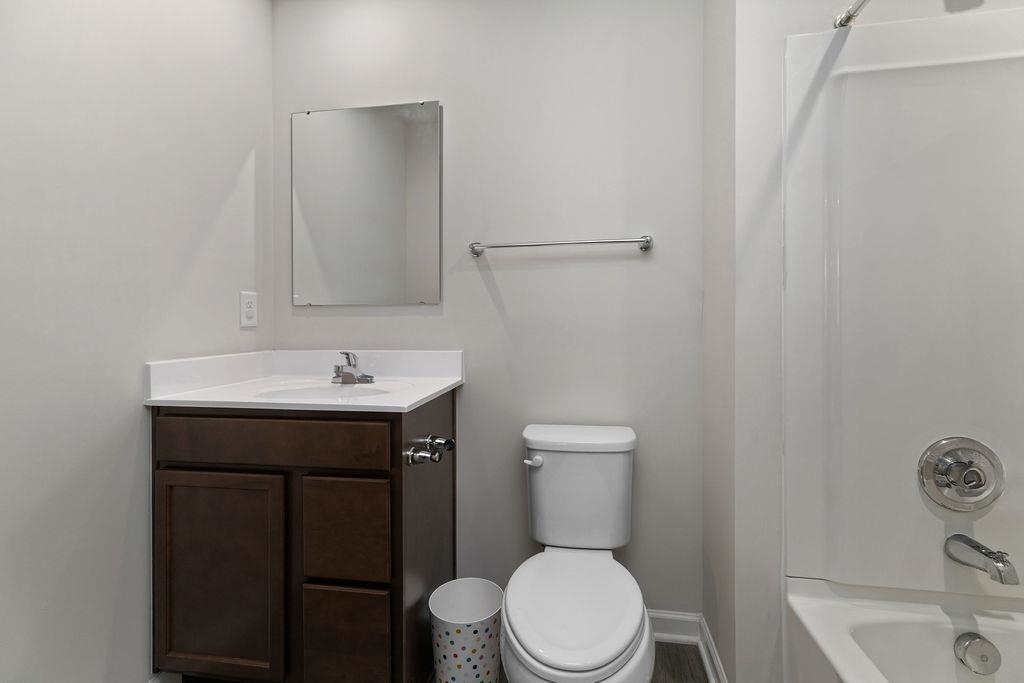 124 Walsh Lane Waynesboro, VA 22980 - Photo 24 of 42 a bathroom with a sink a toilet and mirror