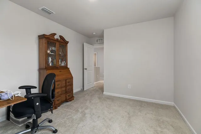 a bed room with a bed and a night stand