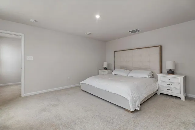 a room with furniture and flat screen tv