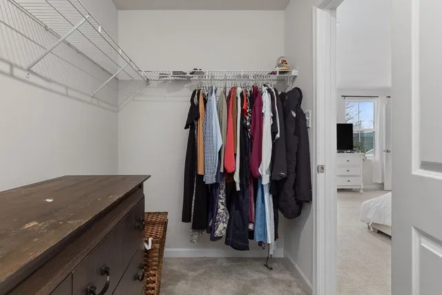a bathroom with a sink vanity and a toilet