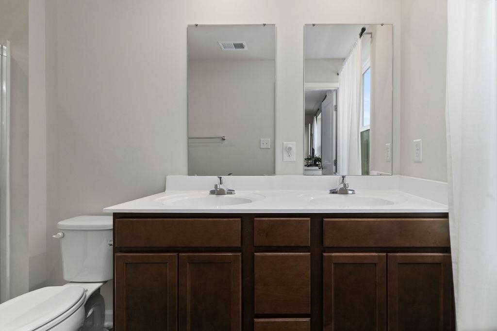 124 Walsh Lane Waynesboro, VA 22980 - Photo 31 of 42 a bathroom with a sink vanity and a toilet