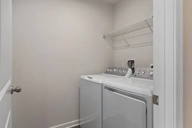 a living room with furniture and a walk in closet