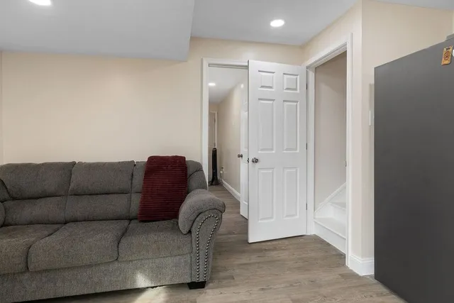 a view of a livingroom with a chair and a window