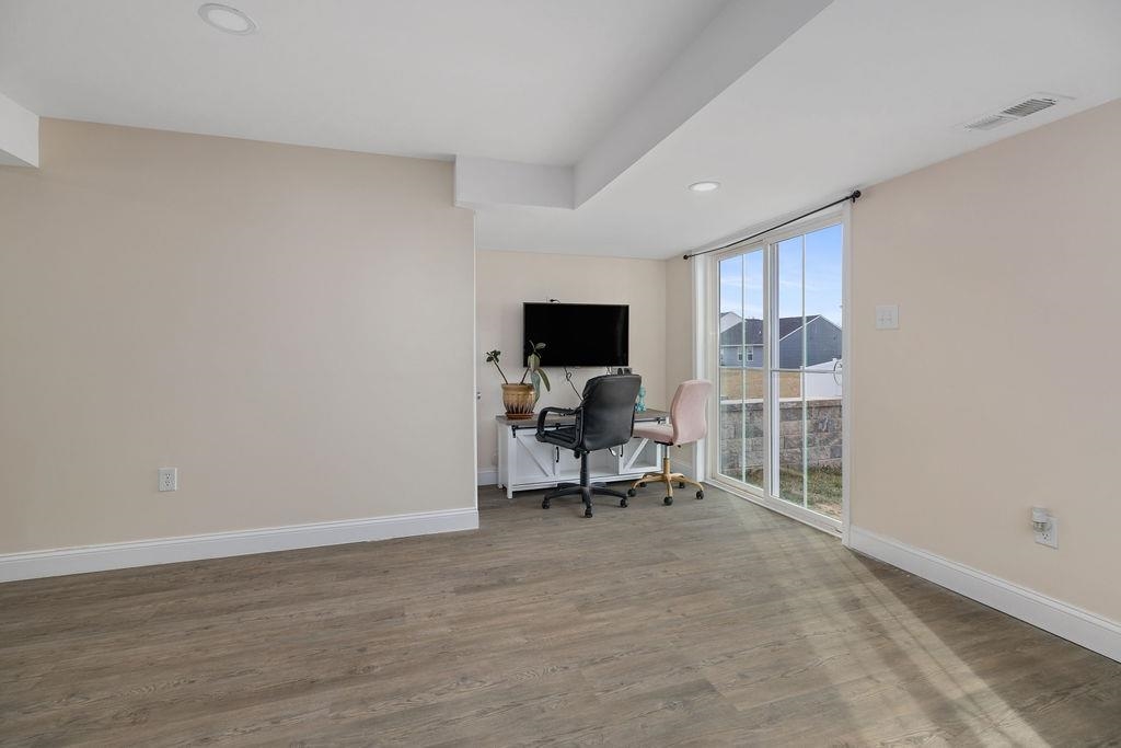124 Walsh Lane Waynesboro, VA 22980 - Photo 35 of 42 a view of a livingroom with a chair and a window