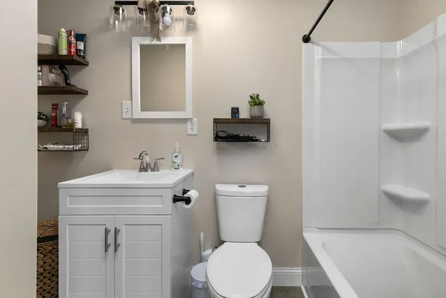 a large white bed in a white room