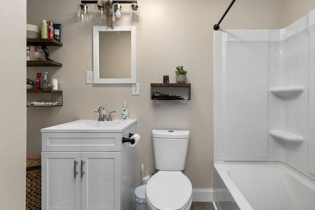 124 Walsh Lane Waynesboro, VA 22980 - Photo 39 of 42 a bathroom with a sink a toilet and shower
