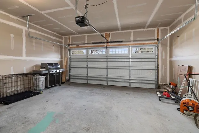 a view of livingroom with furniture and a refrigerator