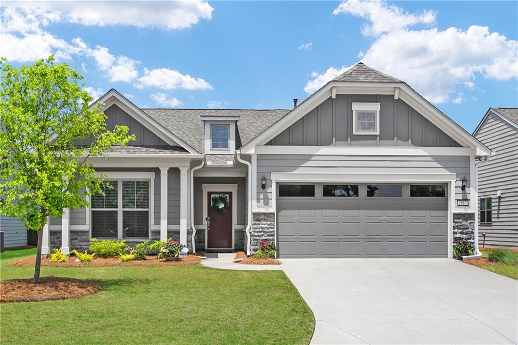2817 Bateman Street Southwest Powder Springs, GA 30127 - Photo 1 of 1 a front view of a house with a yard and porch