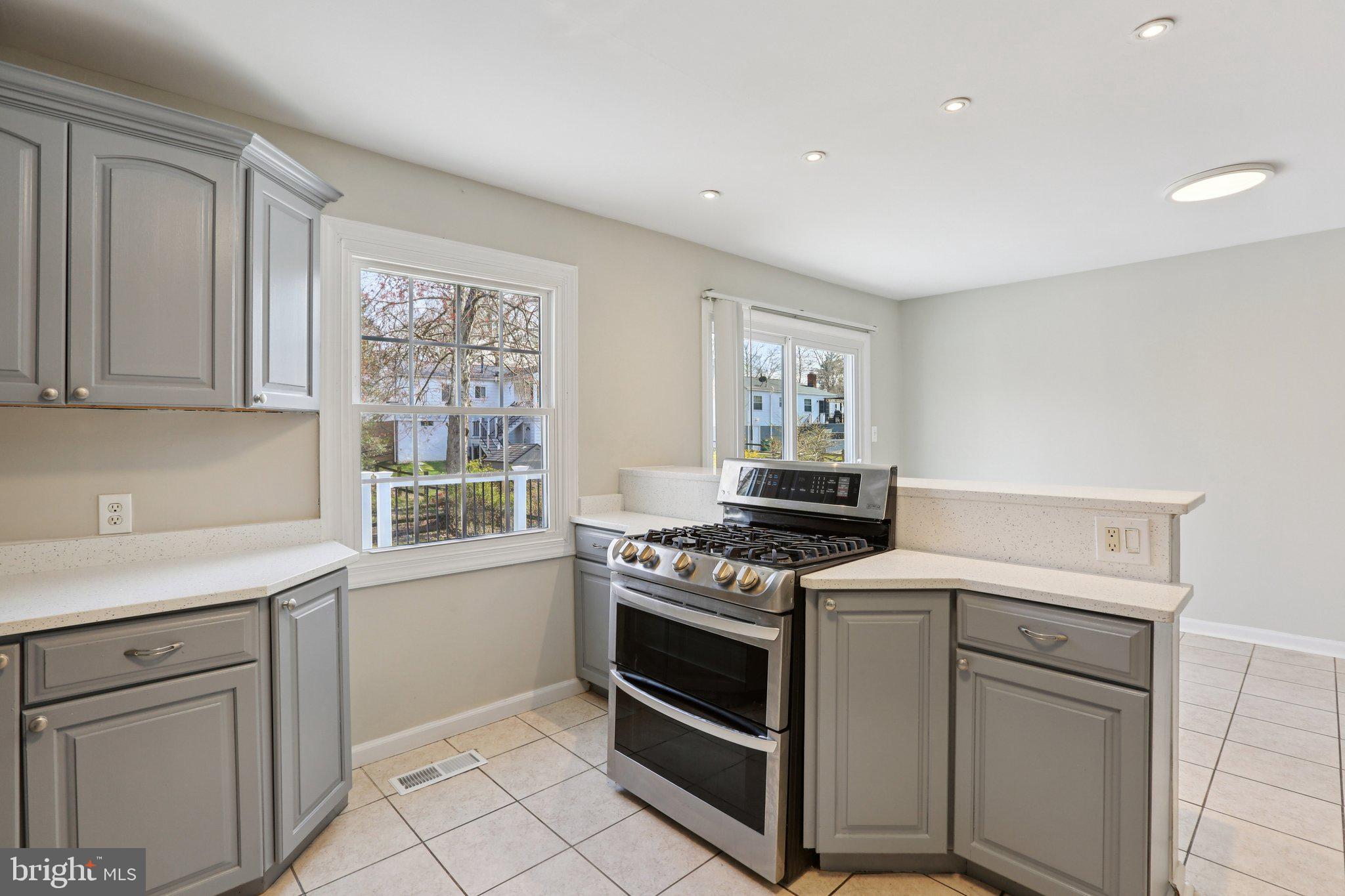 5415 Thunder Hill Road Columbia, MD 21045 - Photo 13 of 54 a kitchen with white cabinets and appliances