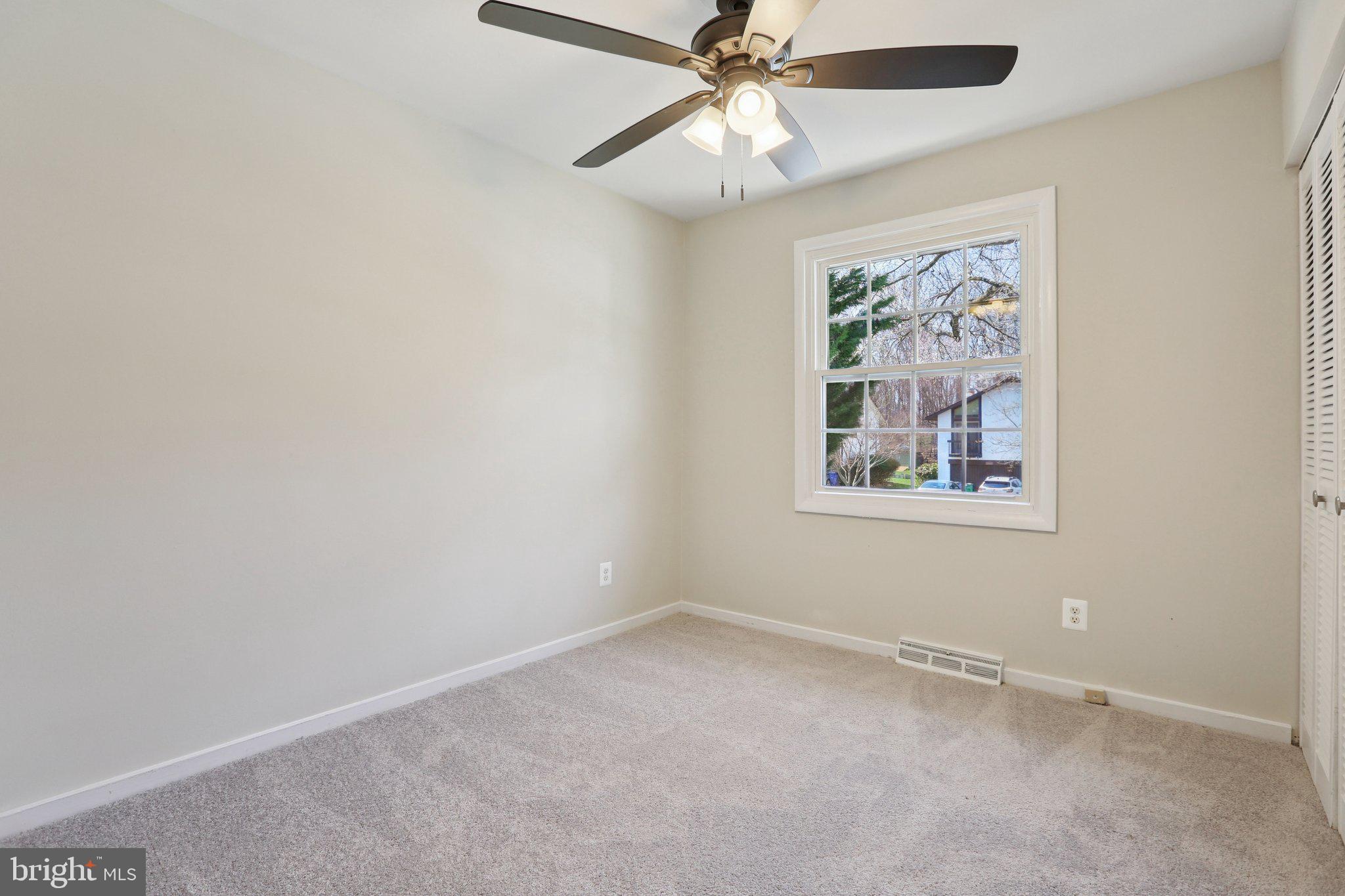 5415 Thunder Hill Road Columbia, MD 21045 - Photo 16 of 54 an empty room with a window and a fan