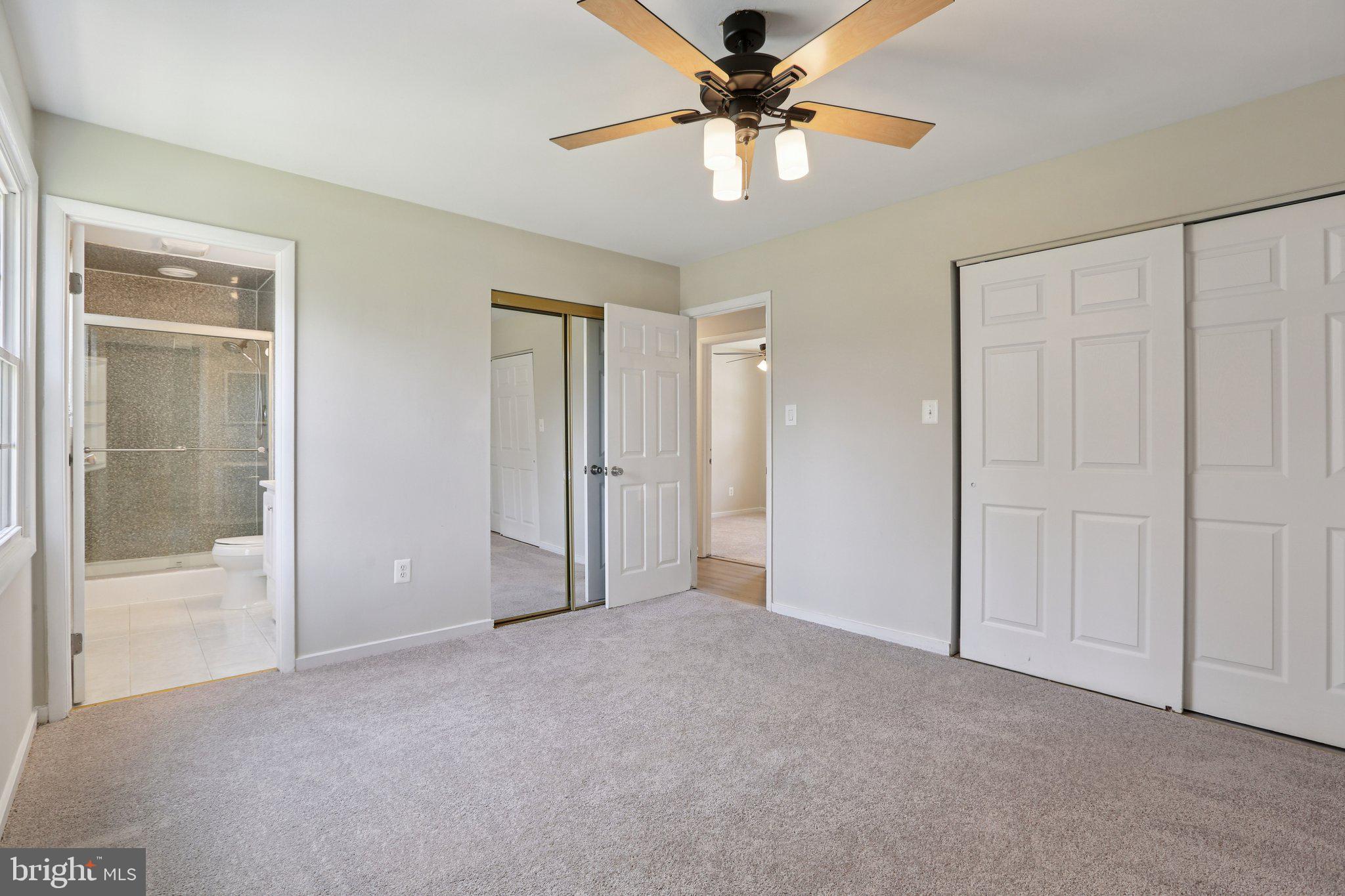 5415 Thunder Hill Road Columbia, MD 21045 - Photo 21 of 54 an empty room with closet and a chandelier fan