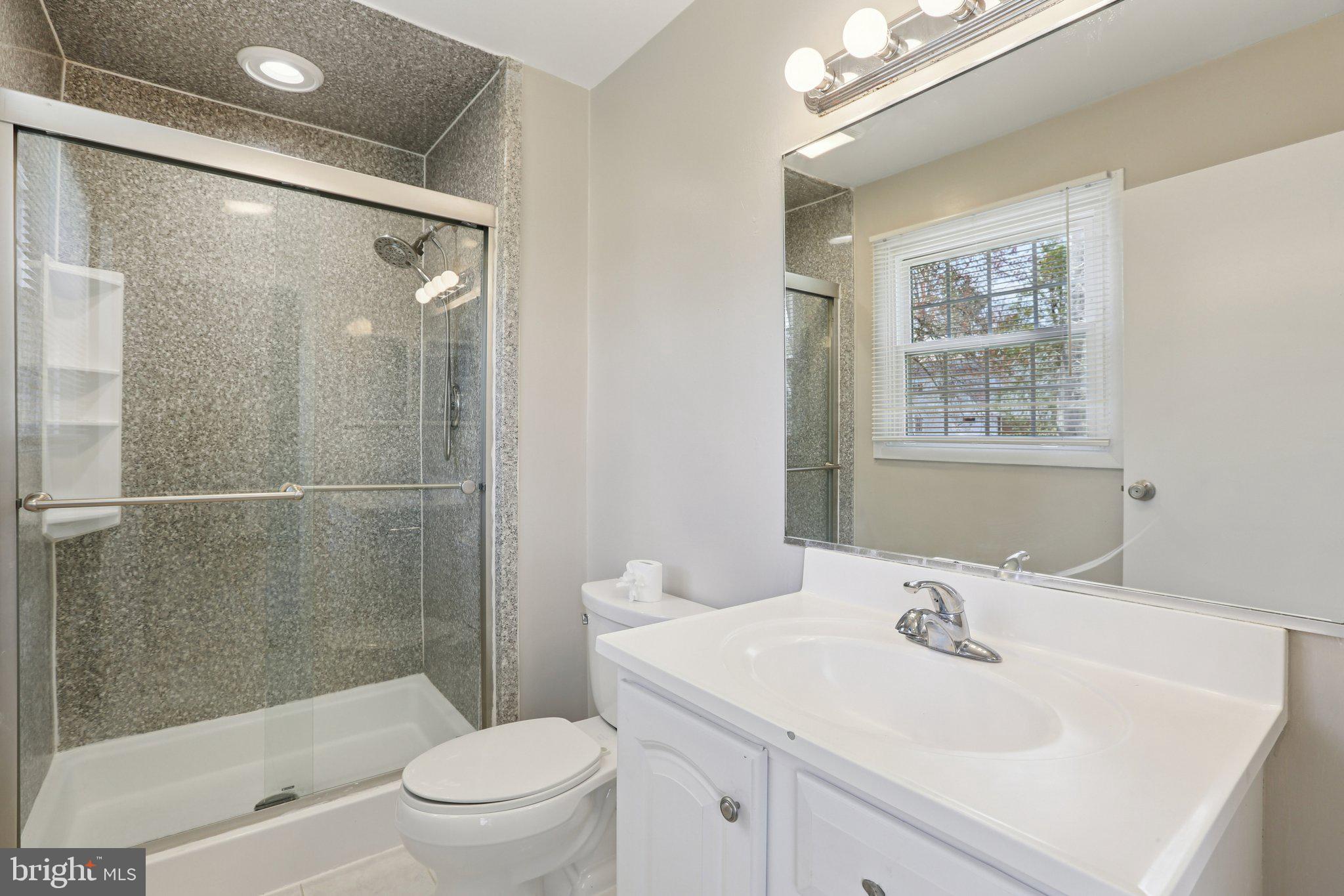 5415 Thunder Hill Road Columbia, MD 21045 - Photo 22 of 54 a bathroom with a sink toilet and shower