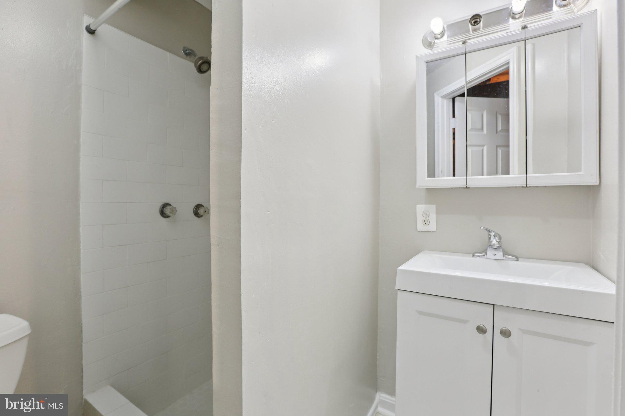 5415 Thunder Hill Road Columbia, MD 21045 - Photo 25 of 54 a bathroom with a sink toilet and shower