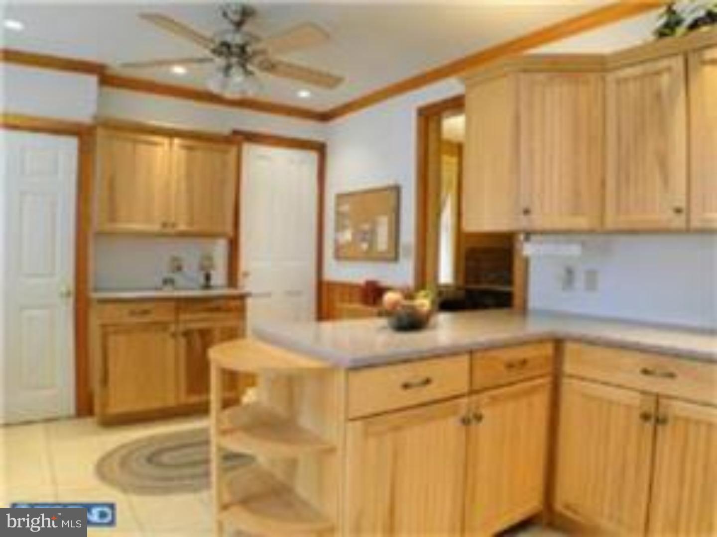 129 Maplewood Road Riegelsville, PA 18077 - Photo 2 of 13 a kitchen with granite countertop a sink stainless steel appliances and cabinets