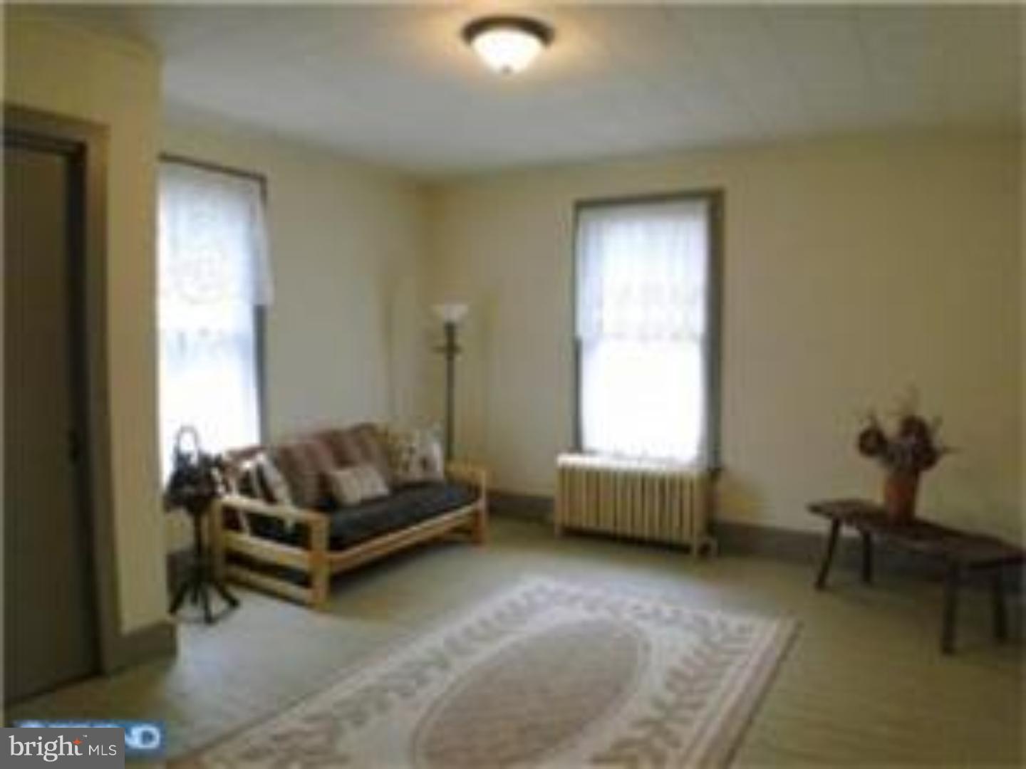 129 Maplewood Road Riegelsville, PA 18077 - Photo 12 of 13 a living room with furniture and a window