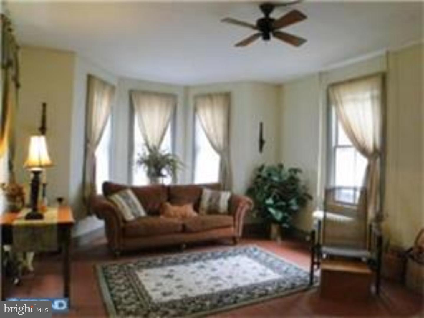 129 Maplewood Road Riegelsville, PA 18077 - Photo 6 of 13 a living room with furniture and a potted plant