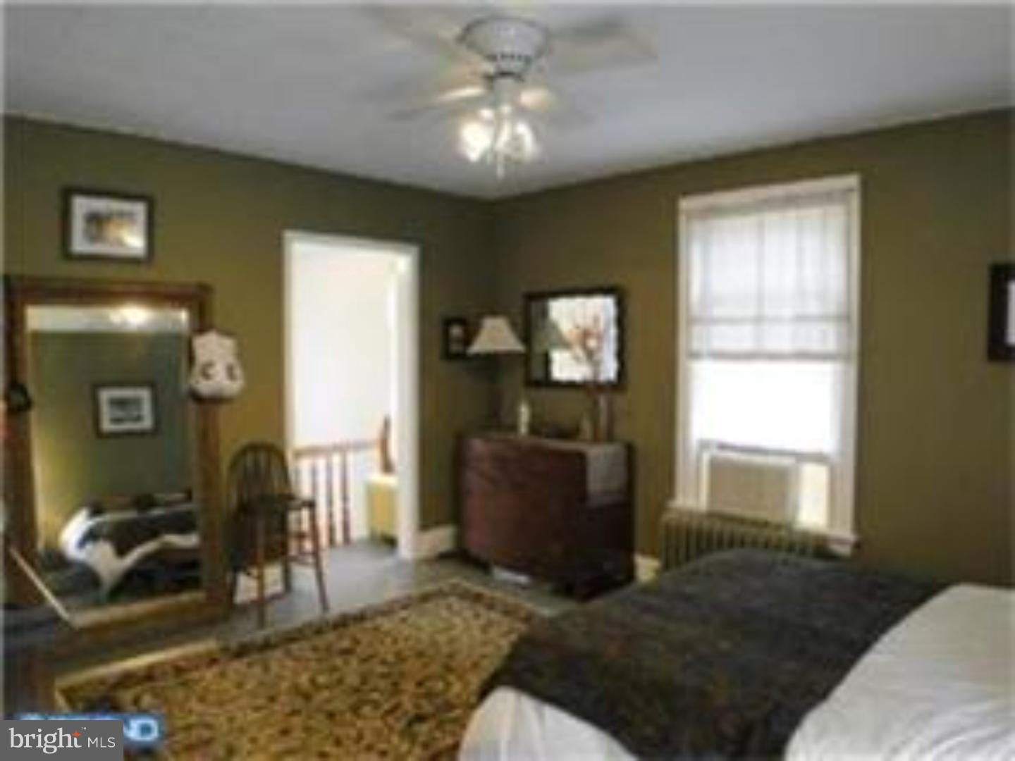 129 Maplewood Road Riegelsville, PA 18077 - Photo 7 of 13 a living room with furniture and a window