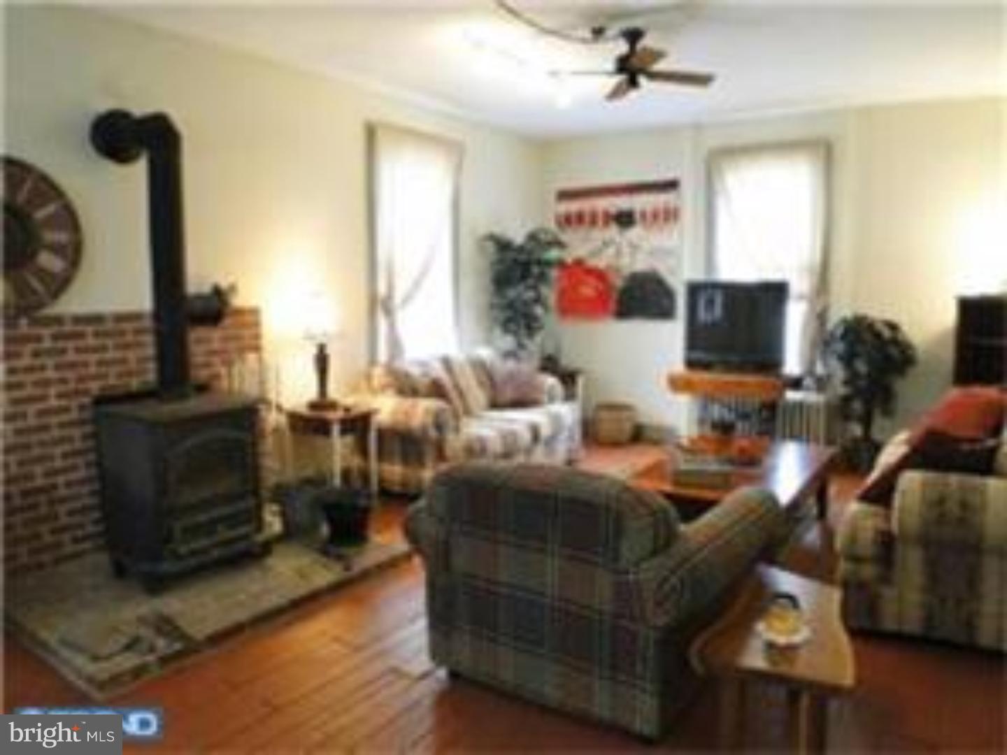 129 Maplewood Road Riegelsville, PA 18077 - Photo 8 of 13 a living room with furniture and a flat screen tv