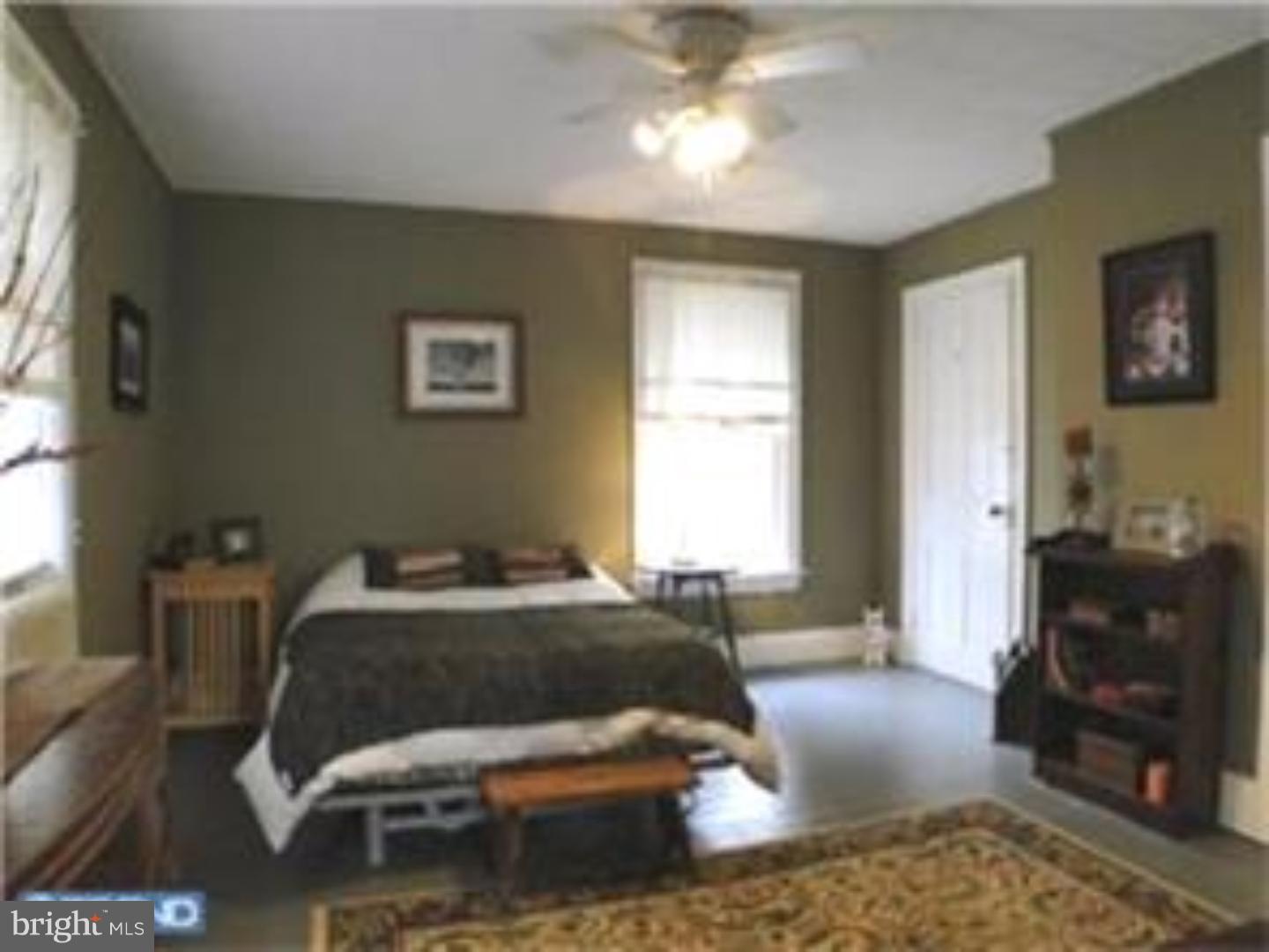 129 Maplewood Road Riegelsville, PA 18077 - Photo 10 of 13 a bedroom with a bed and a couch