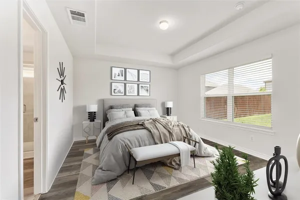 a bed room with furniture and a window
