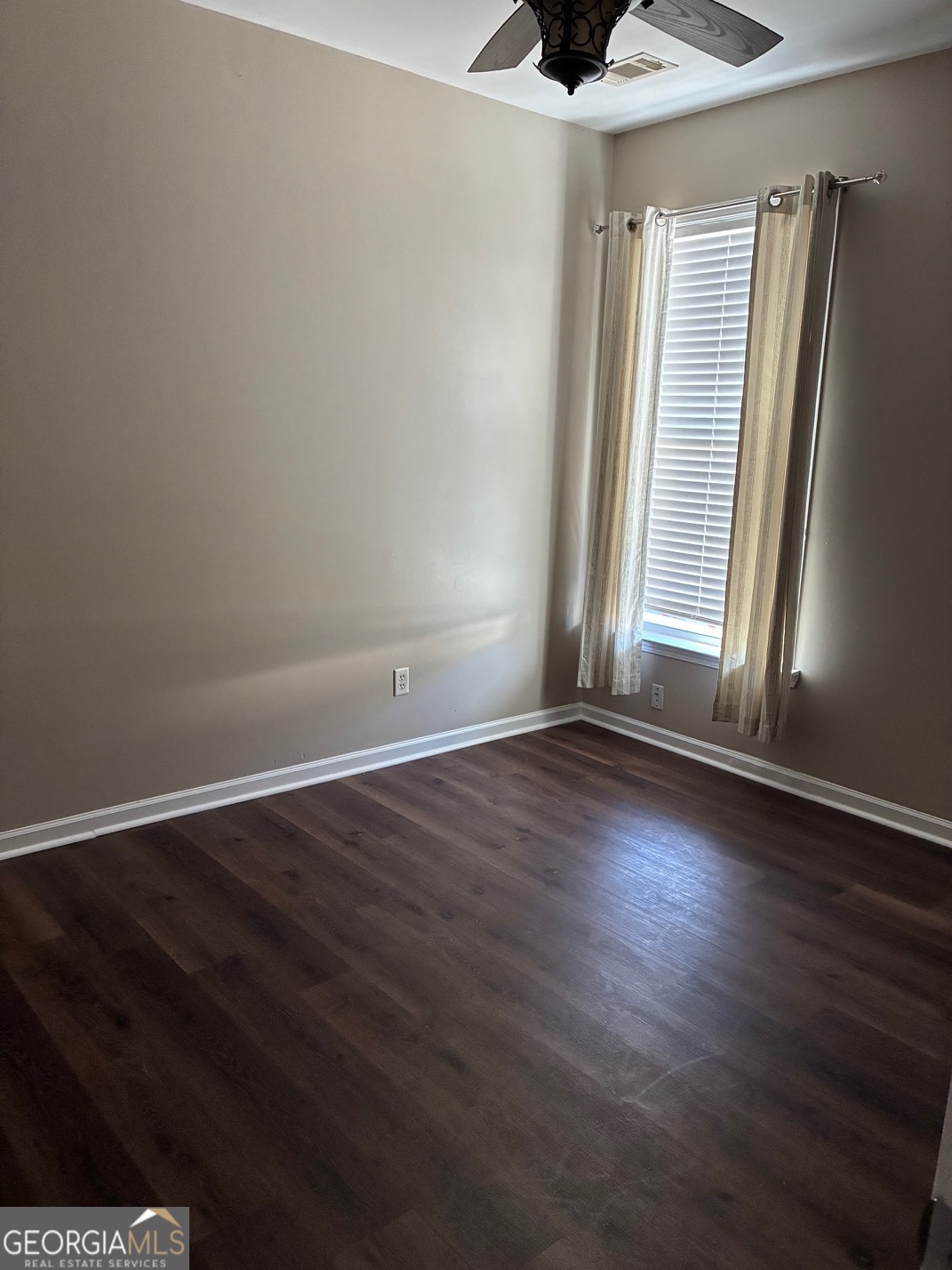 4230 Vinca Way Union City, GA 30291 - Photo 3 of 14 an empty room with wooden floor and windows