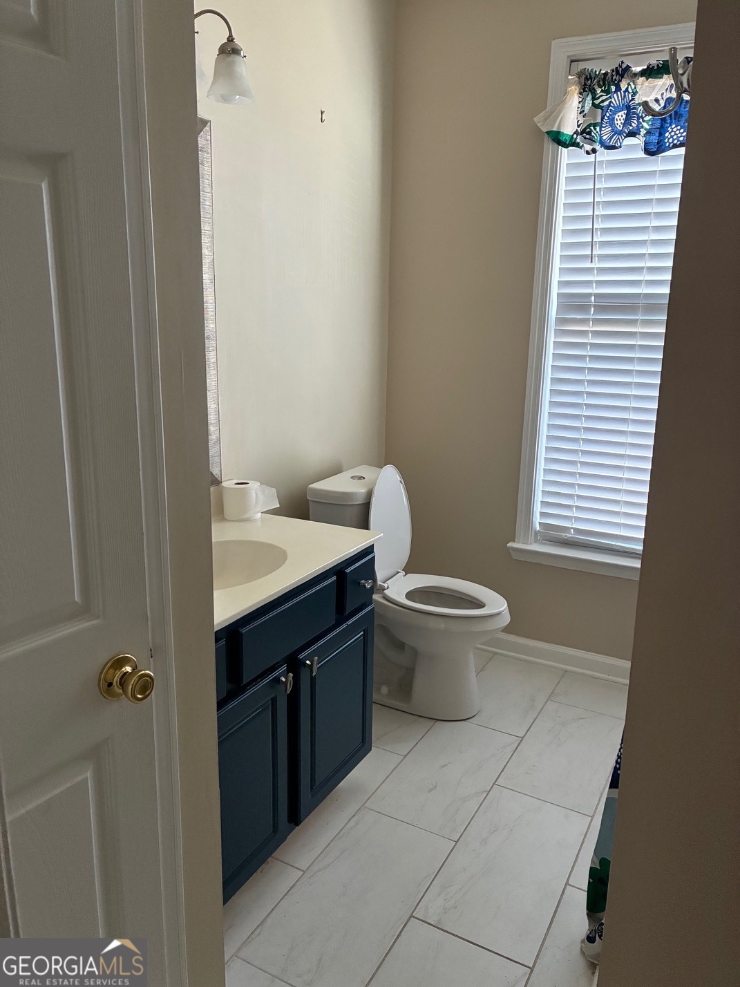 4230 Vinca Way Union City, GA 30291 - Photo 4 of 14 a bathroom with a sink and a toilet