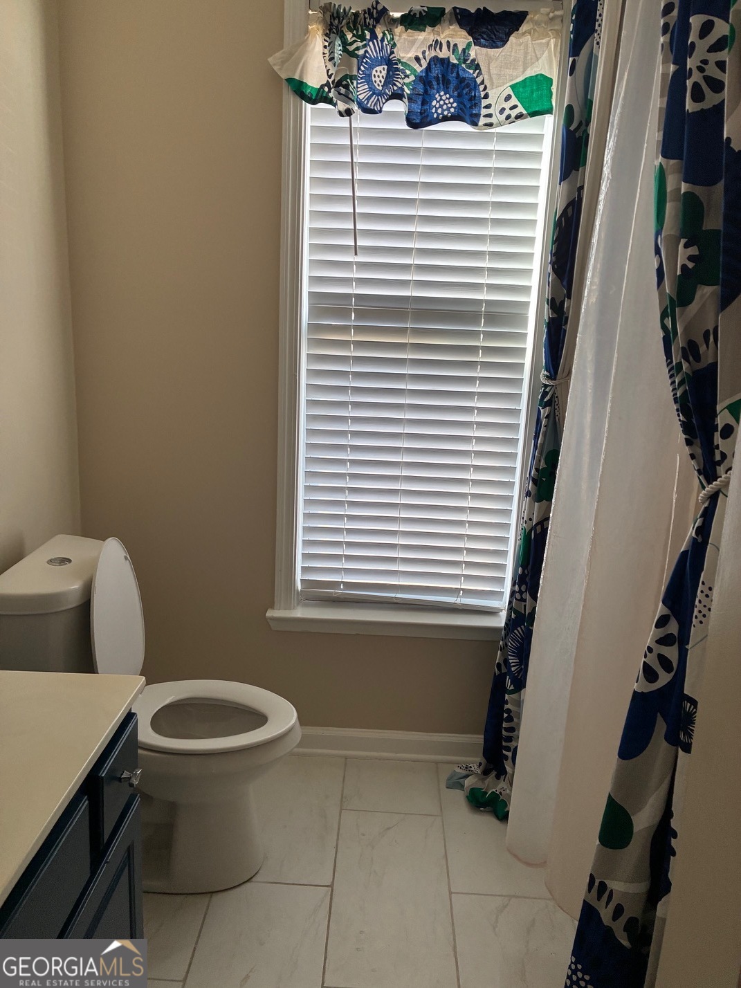 4230 Vinca Way Union City, GA 30291 - Photo 5 of 14 a bathroom with a toilet and a shower
