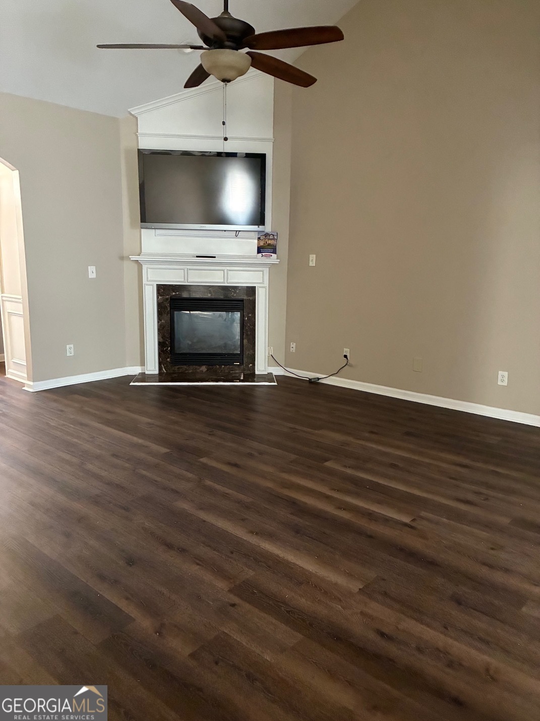 4230 Vinca Way Union City, GA 30291 - Photo 10 of 14 a view of an empty room with wooden floor fireplace and a window