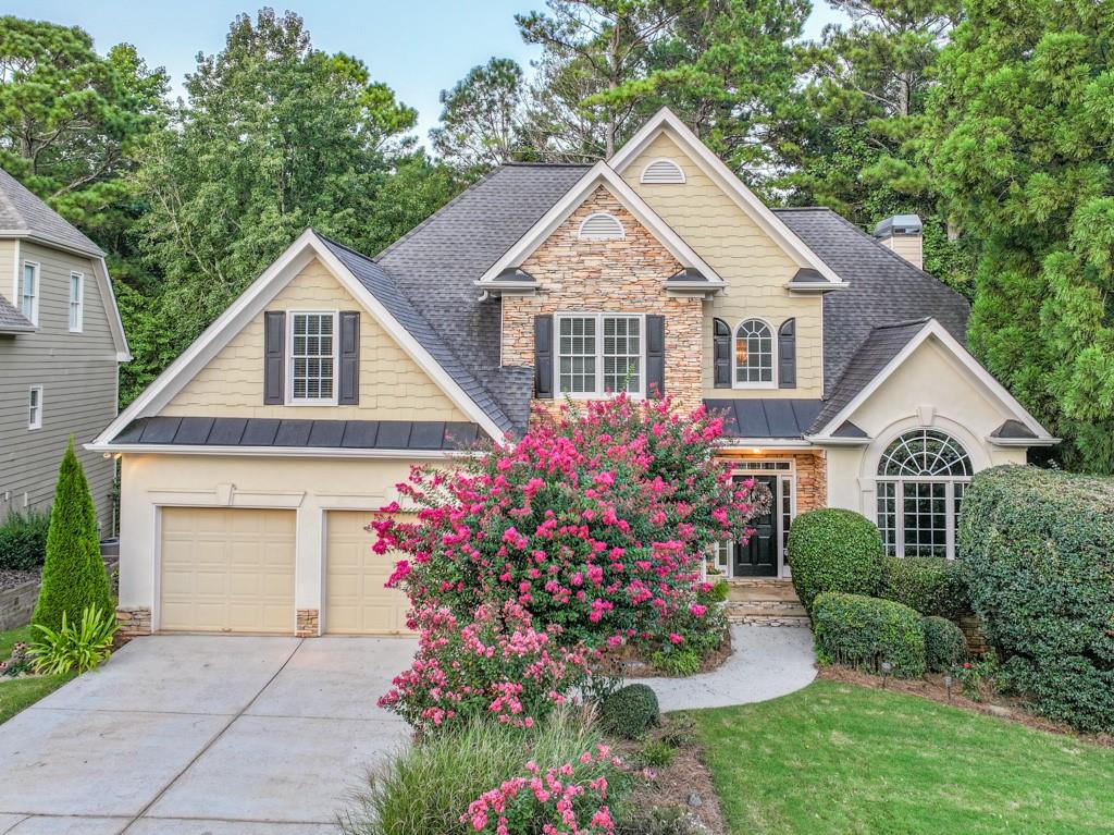 a front view of a house with a yard