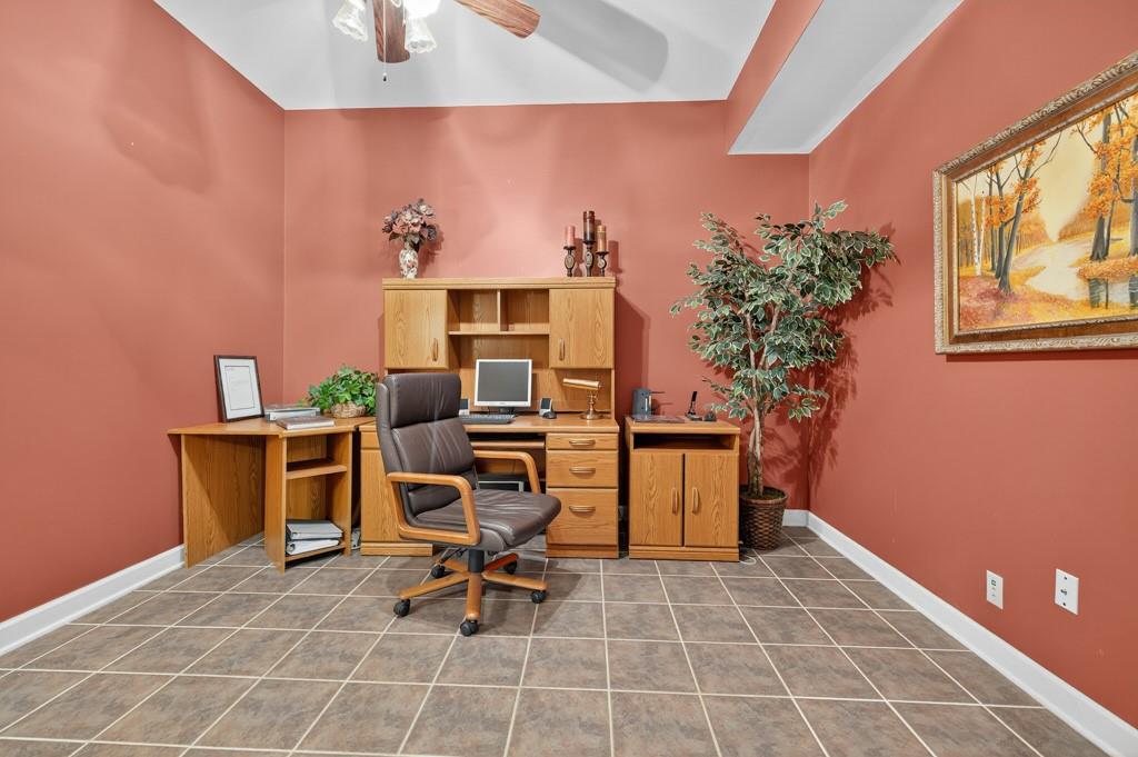 994 Fairview Club Circle Dacula, GA 30019 - Photo 29 of 57 a view of a workspace with furniture and a potted plant
