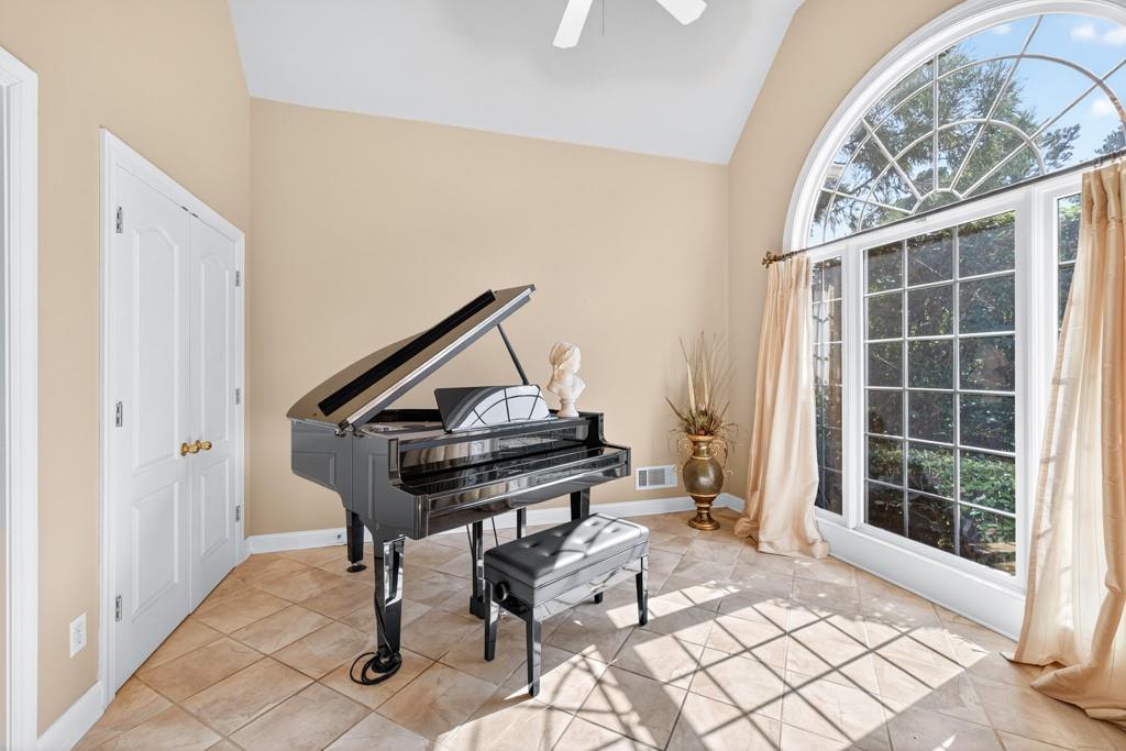 994 Fairview Club Circle Dacula, GA 30019 - Photo 4 of 57 a living room with a couch and a window