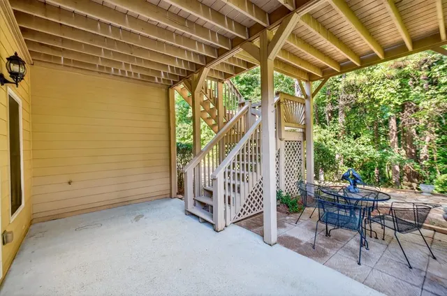 an aerial view of a house with garden space and outdoor seating