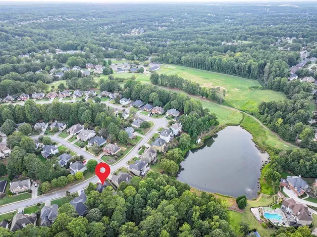 a view of a lake with huge green field
