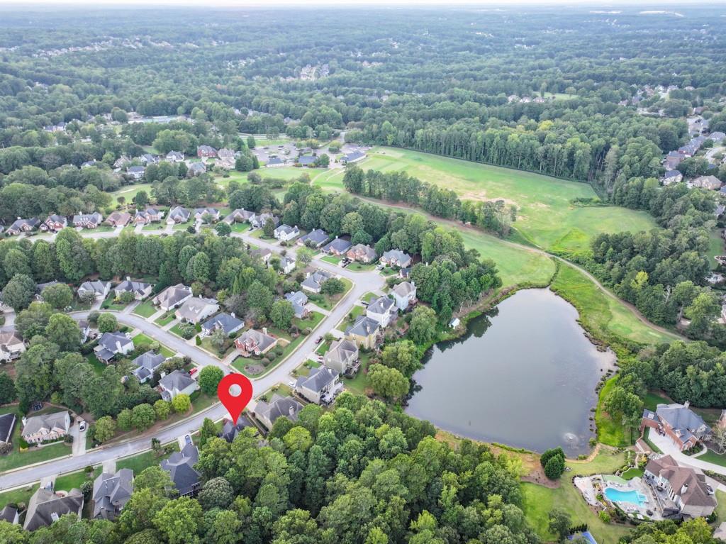 994 Fairview Club Circle Dacula, GA 30019 - Photo 46 of 57 an aerial view of a houses with a yard and lake