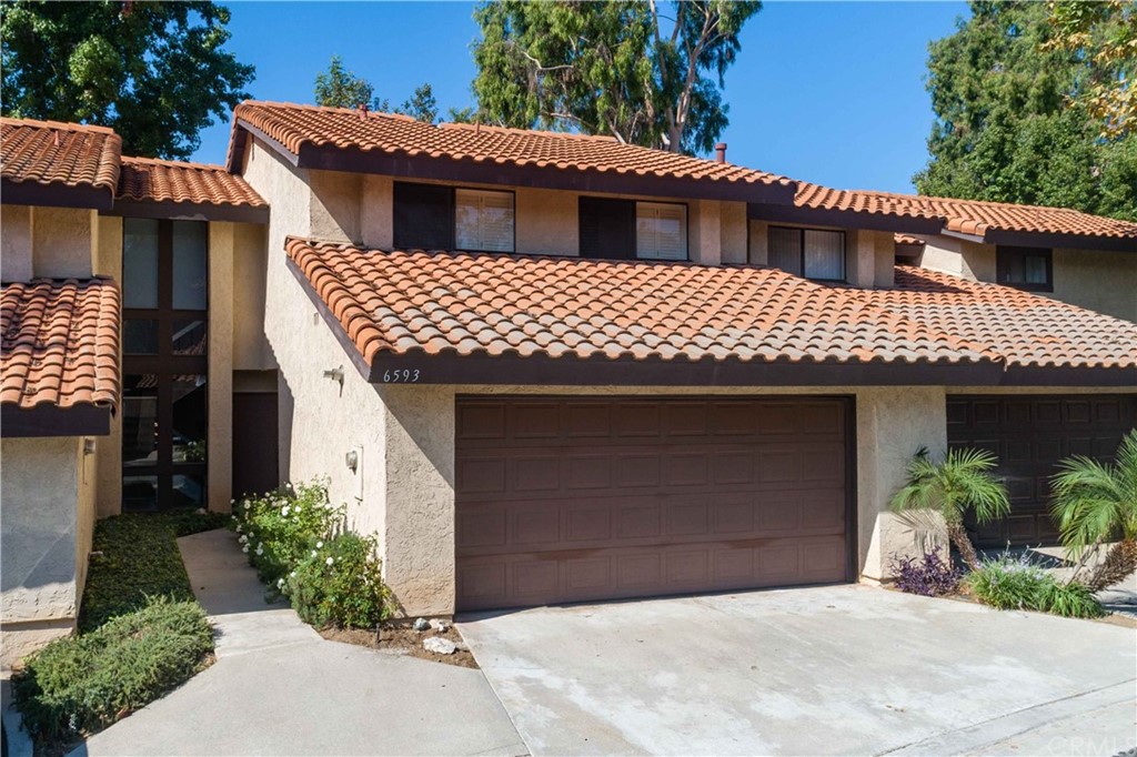 a front view of a house with a garage