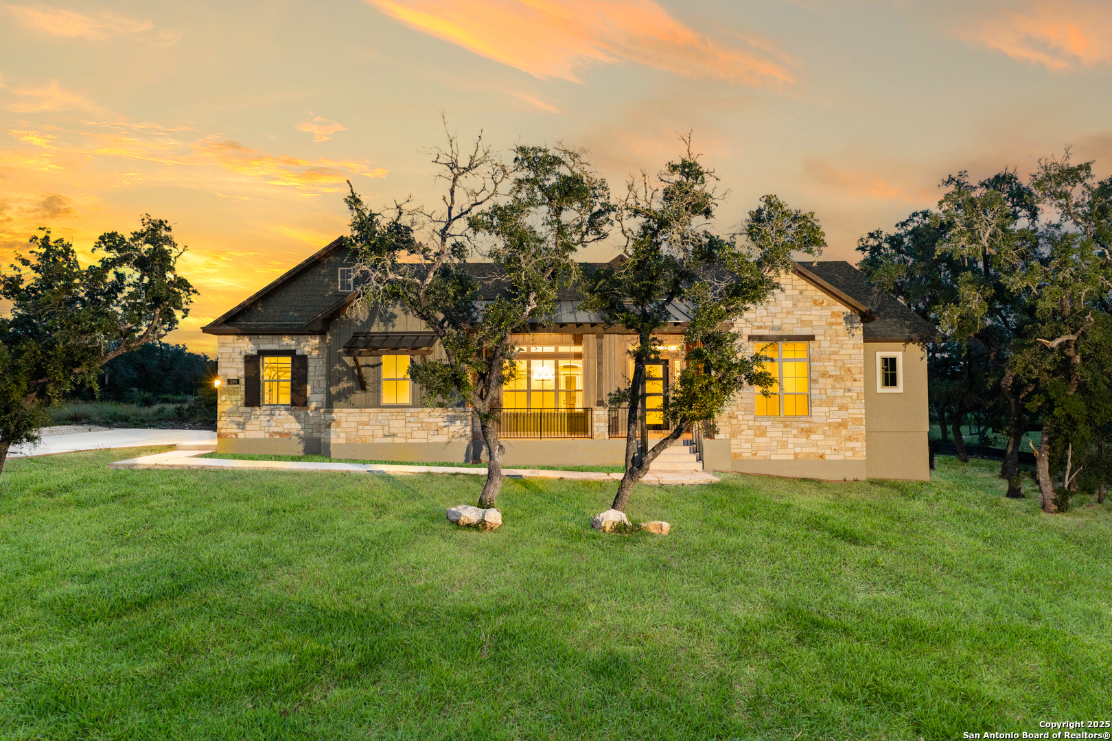 399 James Way Castroville, TX 78009 - Photo 1 of 32 a house view with a play ground in front of it