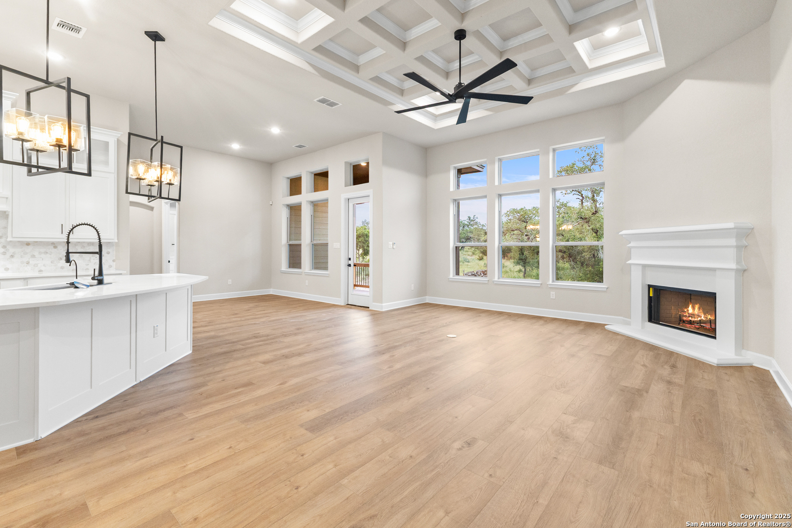 399 James Way Castroville, TX 78009 - Photo 14 of 32 a view of an empty room with a window and fireplace