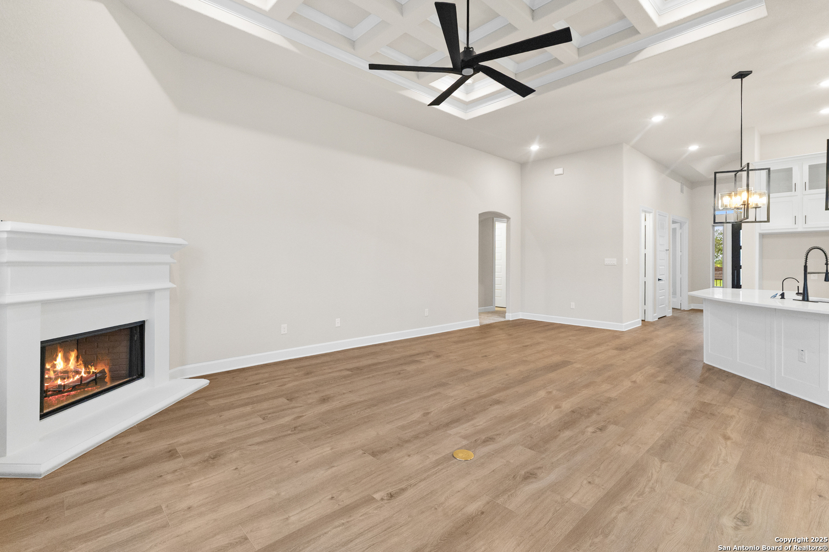 399 James Way Castroville, TX 78009 - Photo 16 of 32 a view of an empty room with a fireplace