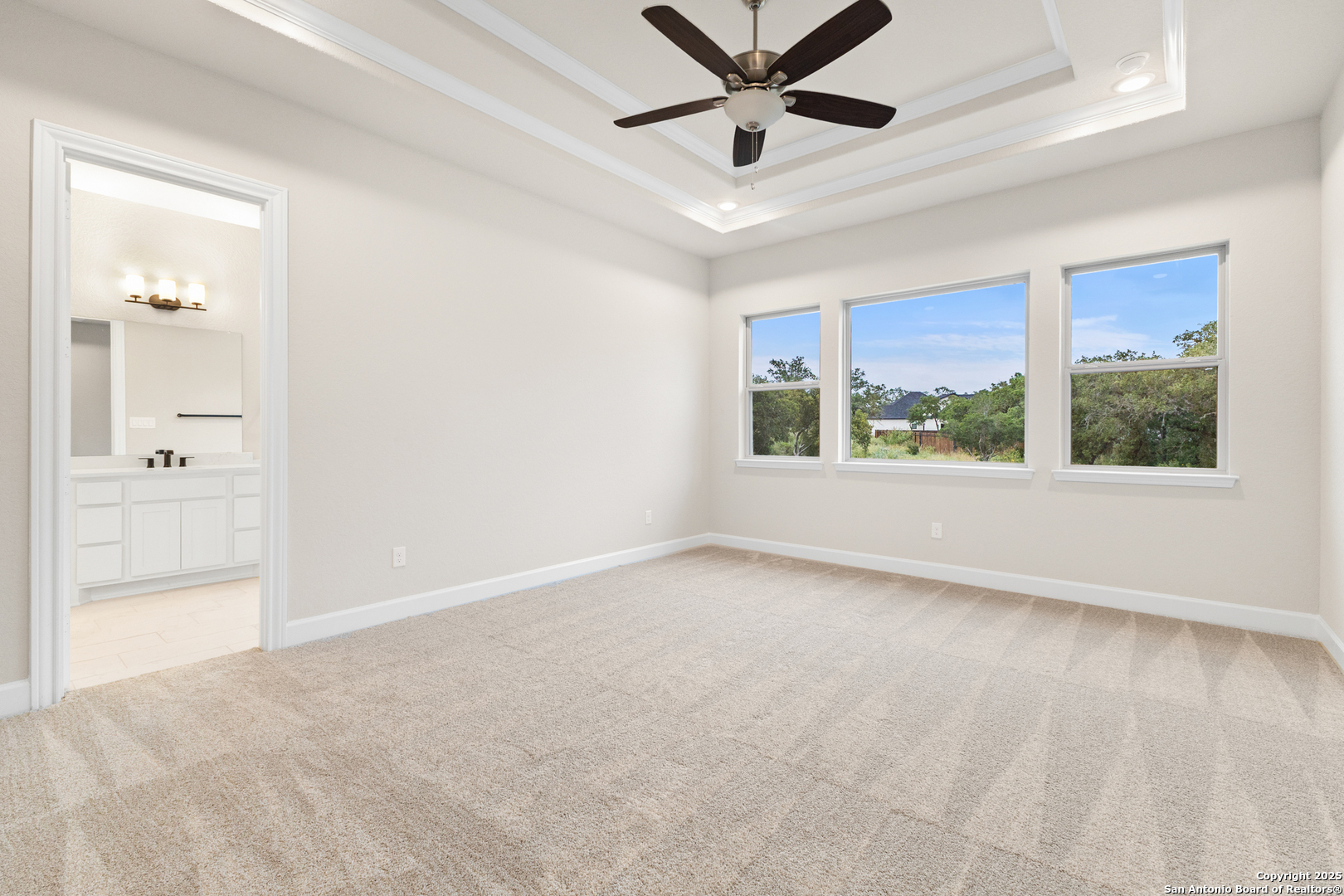 399 James Way Castroville, TX 78009 - Photo 18 of 32 wooden floor in an empty room with a window