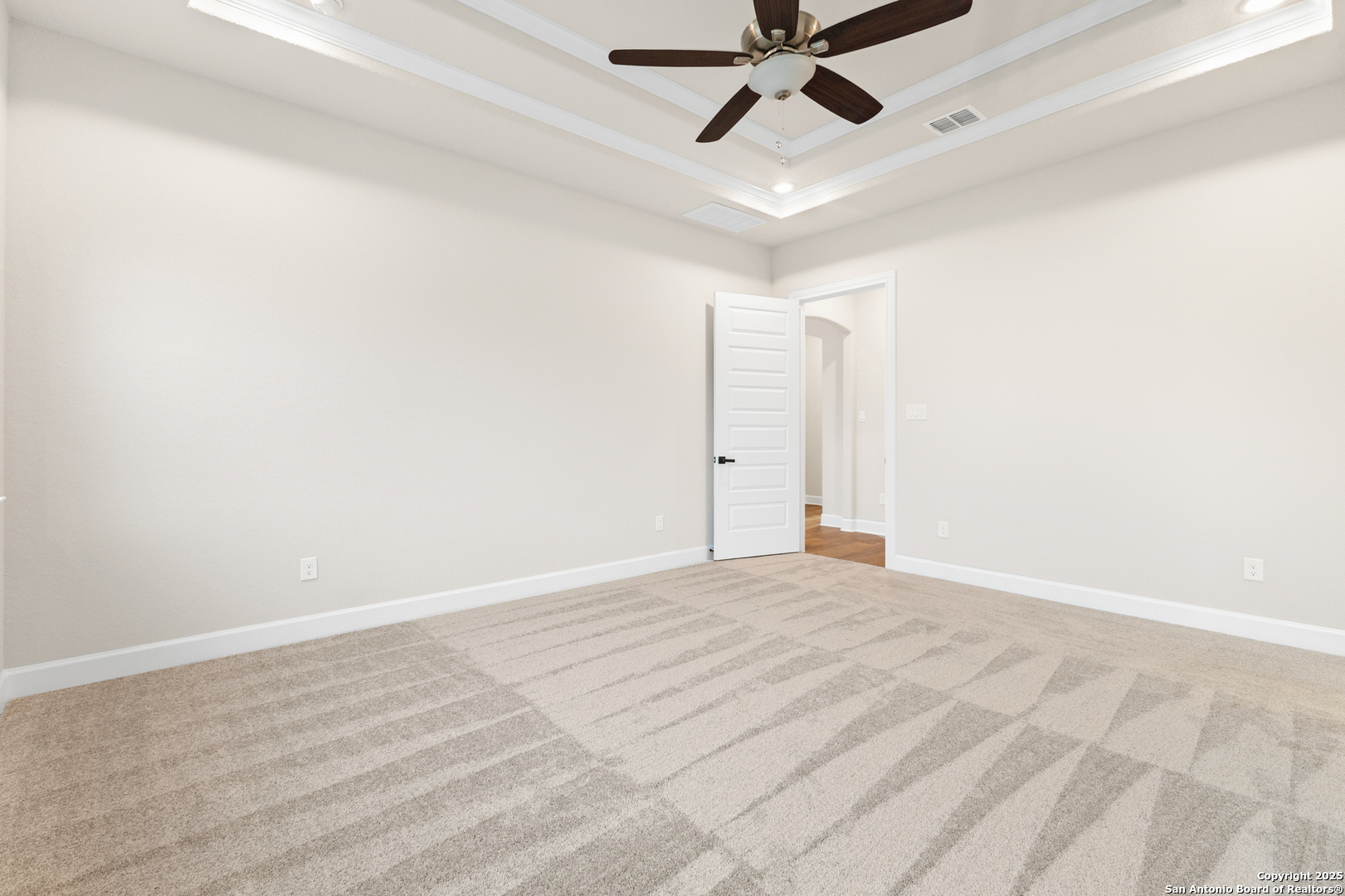 399 James Way Castroville, TX 78009 - Photo 19 of 32 a view of a livingroom with a ceiling fan and hardwood floor