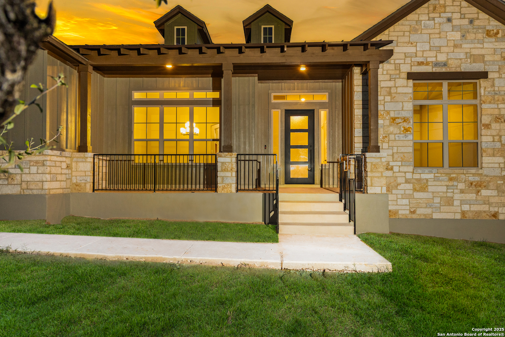 399 James Way Castroville, TX 78009 - Photo 2 of 32 a view of a brick house with a large windows