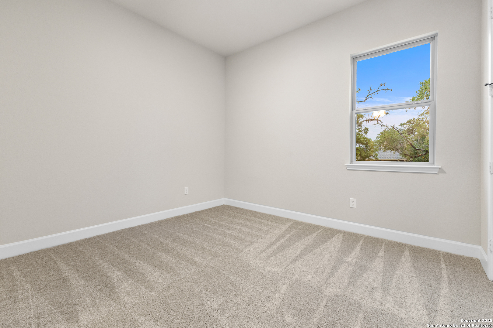 399 James Way Castroville, TX 78009 - Photo 24 of 32 an empty room with windows